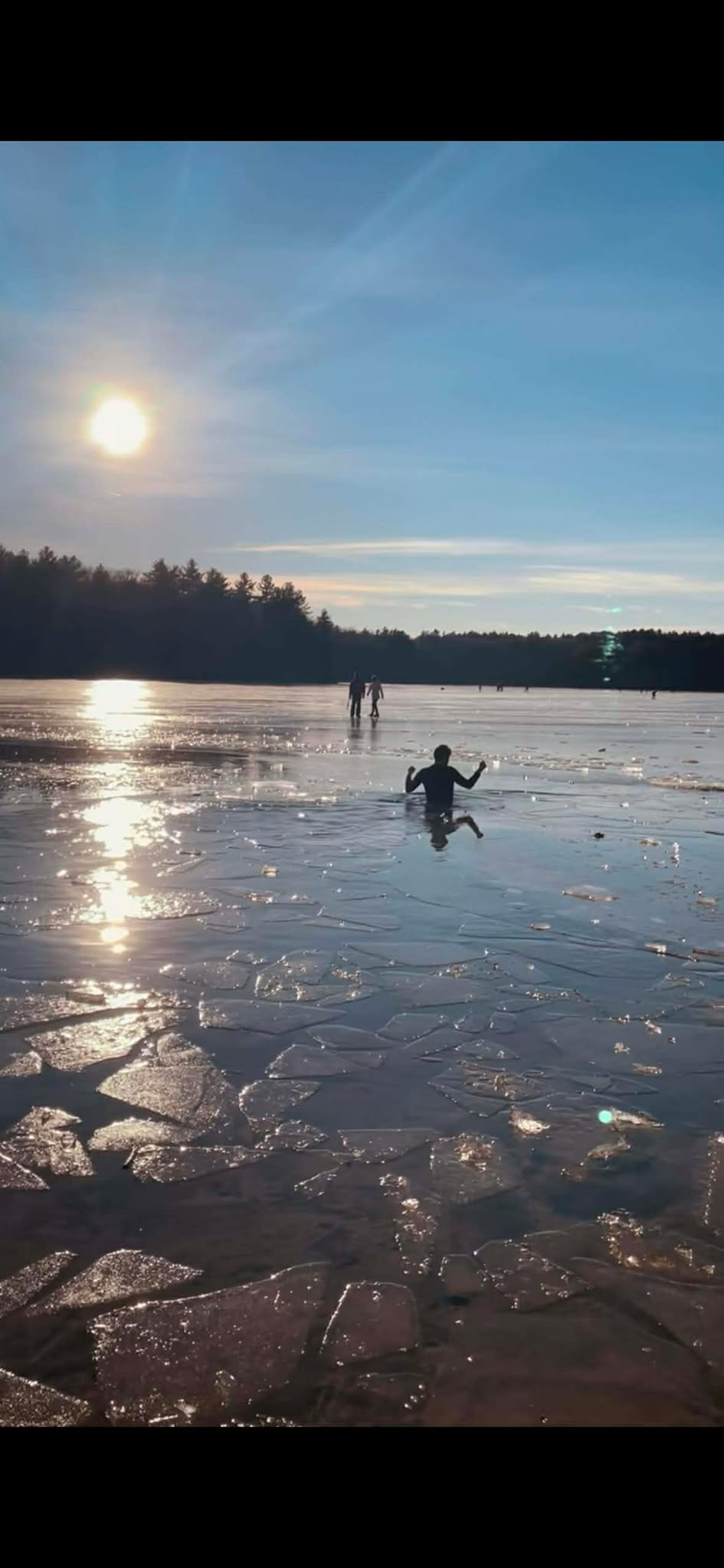 Mathew diving a frozen Walden Pond